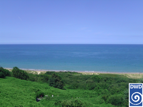 Omaha Beach: Heute ein ganz normaler Badestrand; damals einer der Hauptschauplätze bei den Kampfhandlungen des D-Days am 06. Juni 1944 (Quelle DWD)